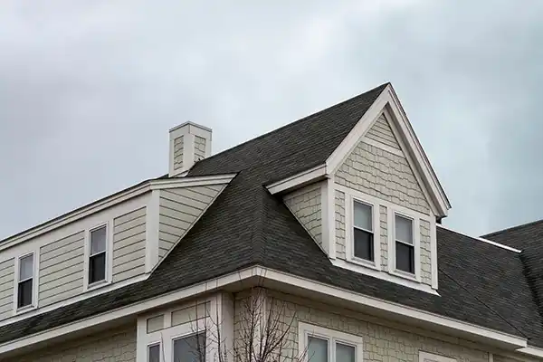 Mid-class home with a black shingle roof